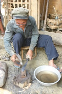 Project Phongsali: In the spirit of “swords into plowshares” a local blacksmith turns bomb fragments into useful tools.