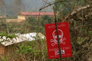 Project Phongsali: The village school is within lethal range of cluster munitions.  The school was built on uncleared land!