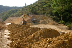 Project Phongsali 2011:  Road crews move soil about.  Villagers find bombs and other ordnance.